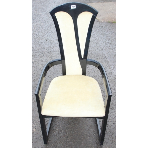 154 - A pair of black and white designed armchairs, likely Italian, each approx 110cm tall