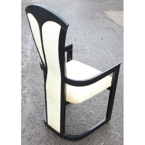 154 - A pair of black and white designed armchairs, likely Italian, each approx 110cm tall