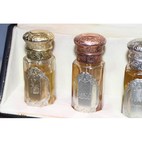 1670 - Fragrance Arabia unisex 5 scent collection in faceted glass bottles with various	coloured metal tops... 