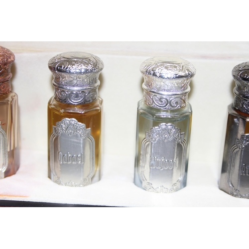 1670 - Fragrance Arabia unisex 5 scent collection in faceted glass bottles with various	coloured metal tops... 