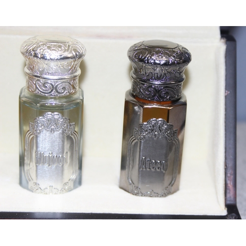 1670 - Fragrance Arabia unisex 5 scent collection in faceted glass bottles with various	coloured metal tops... 