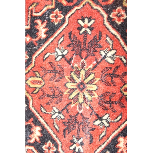 204 - 2 small runner rugs of red coloured ground, largest approx 139 x 37cm