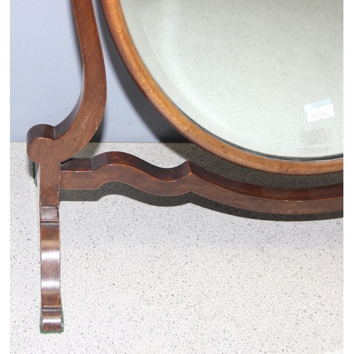 284 - A 19th century mahogany framed oval shaped table top mirror on stand, approx 56cm tall x 45cm wide