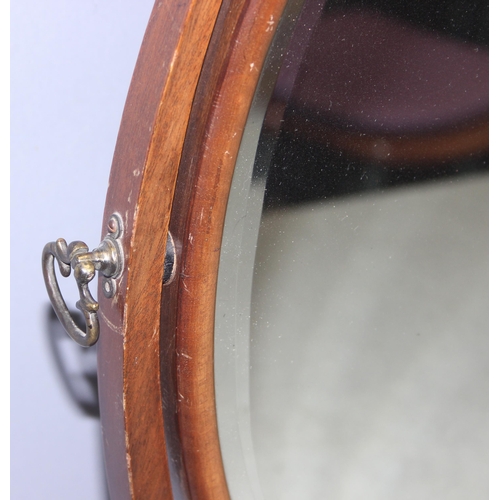 284 - A 19th century mahogany framed oval shaped table top mirror on stand, approx 56cm tall x 45cm wide