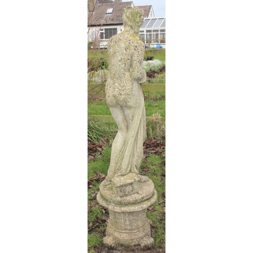 308 - A weathered concrete garden statue of a classical female on column stand, approx 154cm inc base