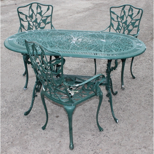 309 - A Victorian style green painted aluminium garden table and chairs, the table approx 138cm W x 80cm D... 