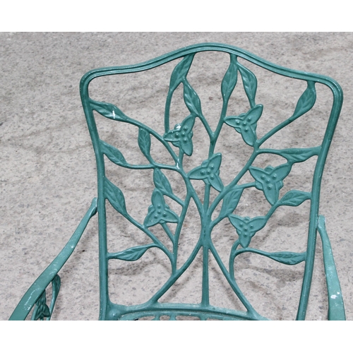 309 - A Victorian style green painted aluminium garden table and chairs, the table approx 138cm W x 80cm D... 