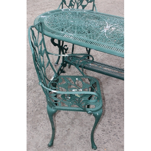 309 - A Victorian style green painted aluminium garden table and chairs, the table approx 138cm W x 80cm D... 