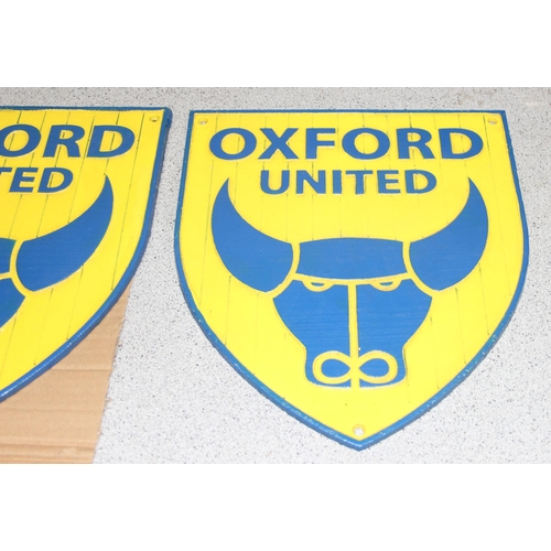 707 - 2 x Oxford United cast metal shield shaped wall plaques, approx 26cm x 30cm