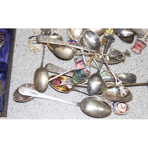 1052 - Qty of assorted silver plated collectors spoons, some with enamel decoration