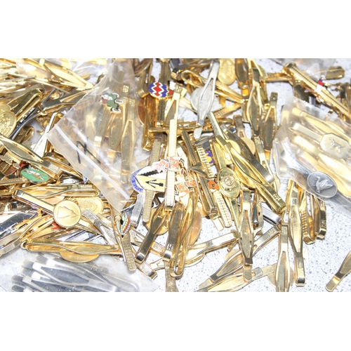 1112 - Qty of vintage tie clips, mostly gold-plated, many with sporting enamelled details, approx 2kg gross