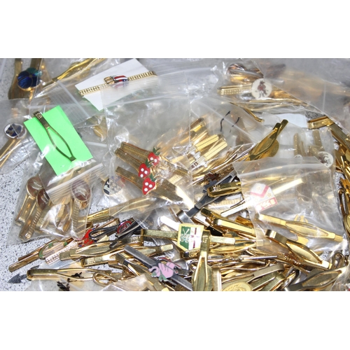 1112 - Qty of vintage tie clips, mostly gold-plated, many with sporting enamelled details, approx 2kg gross