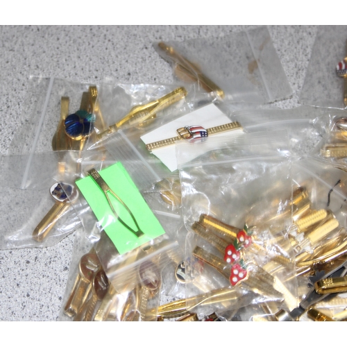 1112 - Qty of vintage tie clips, mostly gold-plated, many with sporting enamelled details, approx 2kg gross