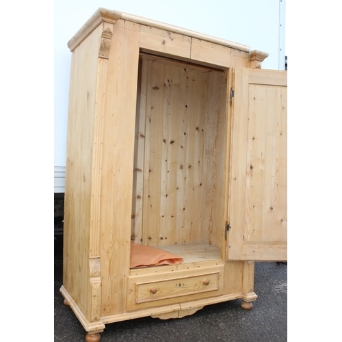 161 - A Victorian pine wardrobe with single drawer to base, approx 124cm wide x 67cm deep x 186cm tall