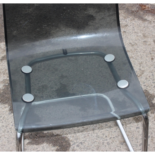 163 - A pair of retro charcoal Perspex and chrome cantilever chairs, seemingly unmarked