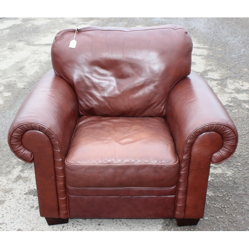 164 - An antique style rolled arm club or armchair with brown leather upholstery by Decro Industrial LTD c... 