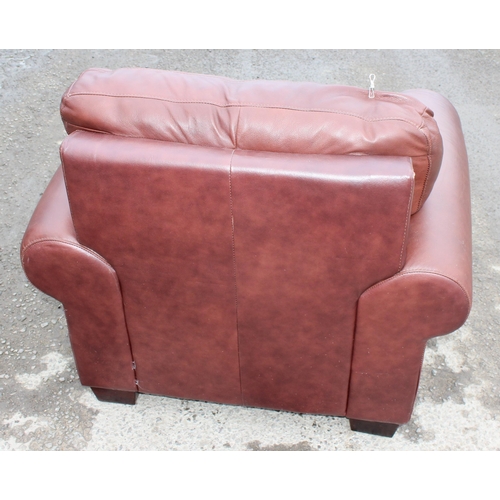 164 - An antique style rolled arm club or armchair with brown leather upholstery by Decro Industrial LTD c... 