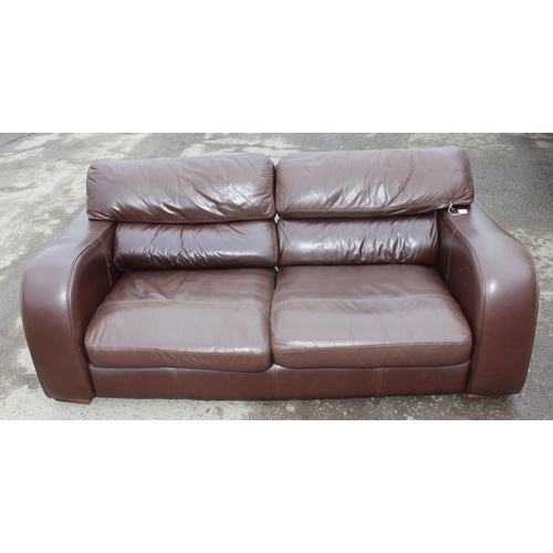 165 - A good quality modern dark brown leather 2 seater sofa, one of 2 matching in the sale with labels fo... 