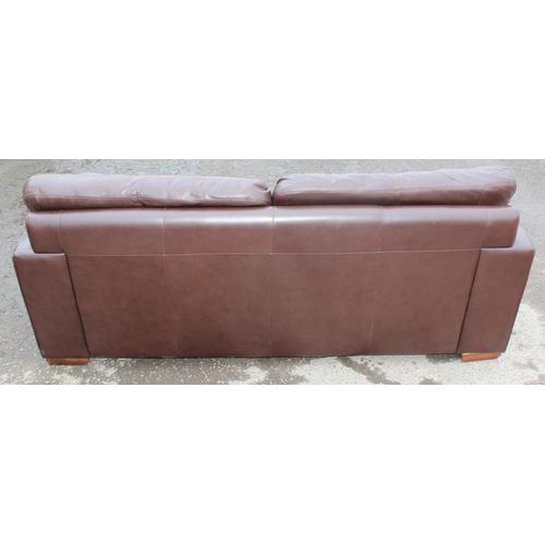 165 - A good quality modern dark brown leather 2 seater sofa, one of 2 matching in the sale with labels fo... 