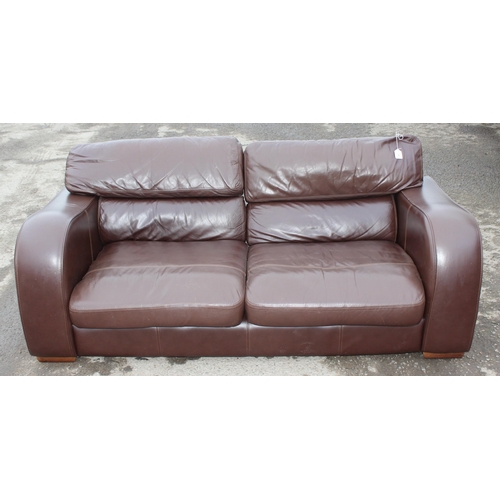 166 - A good quality modern dark brown leather 2 seater sofa, one of 2 matching in the sale with labels fo... 