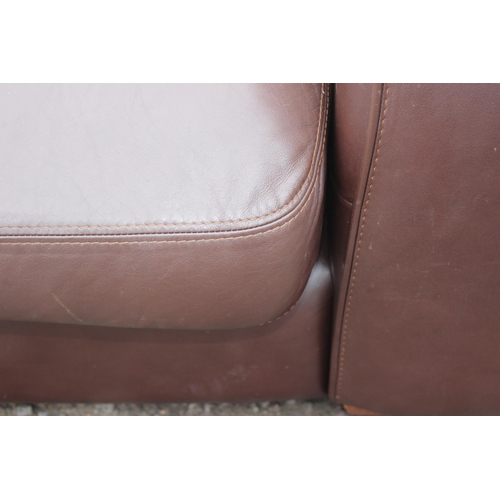 166 - A good quality modern dark brown leather 2 seater sofa, one of 2 matching in the sale with labels fo... 