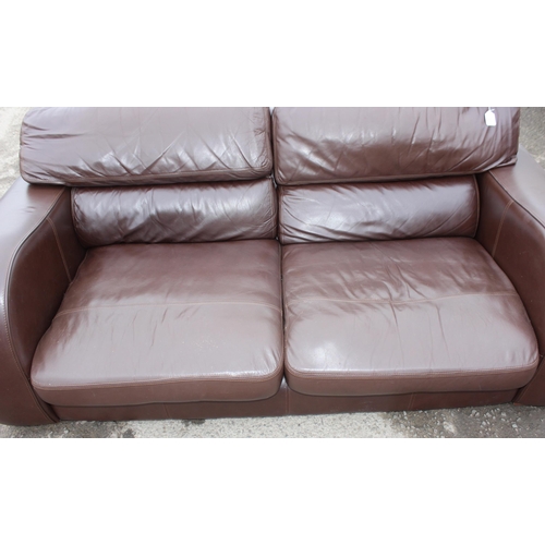 166 - A good quality modern dark brown leather 2 seater sofa, one of 2 matching in the sale with labels fo... 