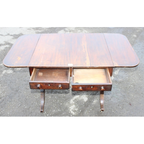 170 - An antique mahogany sofa table with 2 drawers, 2 drop leaves and ceramic castors, approx 74cm (123cm... 