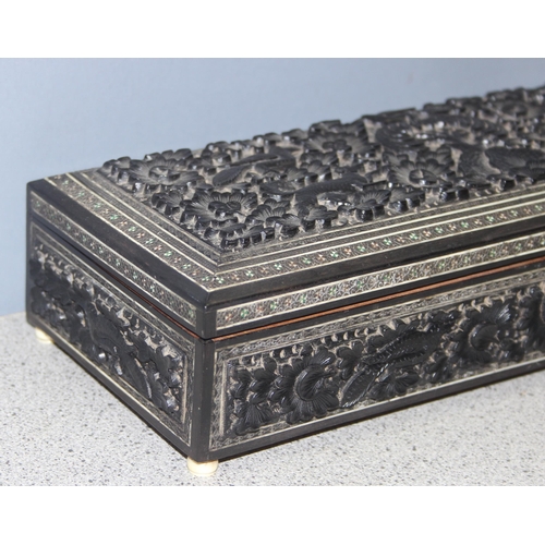 287 - Carved Indian box with inlaid details, depicting dogs and birds, approx 29 x 12 x 6cm