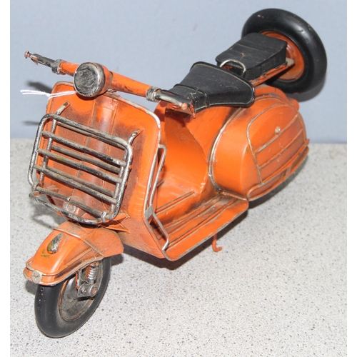 1759 - Ornamental painted tinplate scooter model in orange, believed to be a Lambretta, approx 30cm long