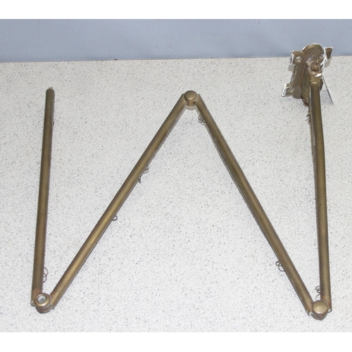 288 - Victorian brass hanging folding curtain rail approx. 146cm long when extended