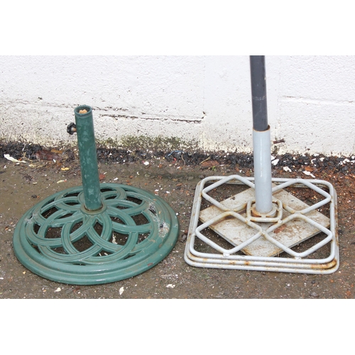 321 - 2 metal garden parasol bases and an umbrella