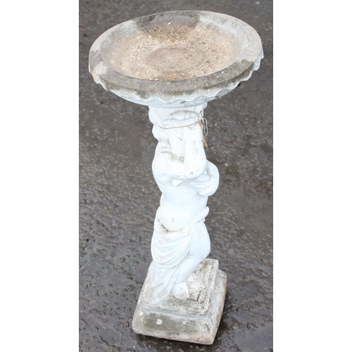 322 - A cast concrete bird bath formed as a boy holding plinth, approx 88cm tall