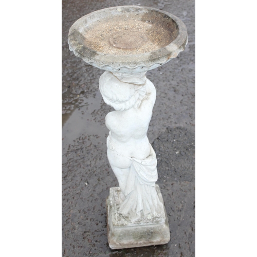 322 - A cast concrete bird bath formed as a boy holding plinth, approx 88cm tall