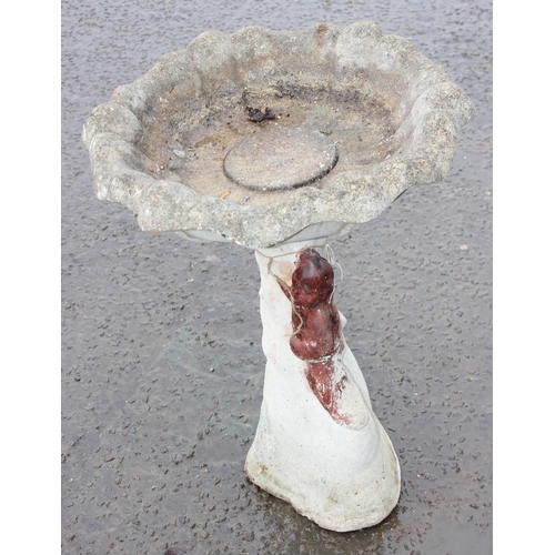 323 - A cast concrete bird bath formed with a painted squirrel, approx 76cm tall