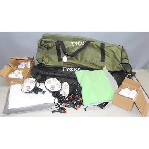 664 - Tycka studio photography lighting equipment in carry case with tripods, backdrops, bulbs etc