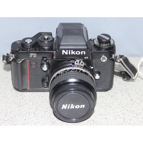 667 - A rare Nikon F3 camera with a Nikkor 24mm 1:2.8 lens