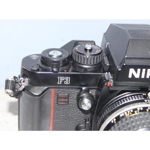 667 - A rare Nikon F3 camera with a Nikkor 24mm 1:2.8 lens