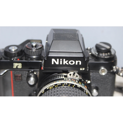 667 - A rare Nikon F3 camera with a Nikkor 24mm 1:2.8 lens