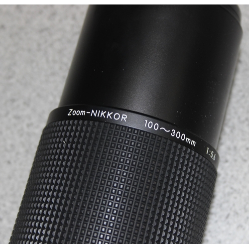 668 - Nikon Nikkor 100-300mm f/5.6 lens in original box