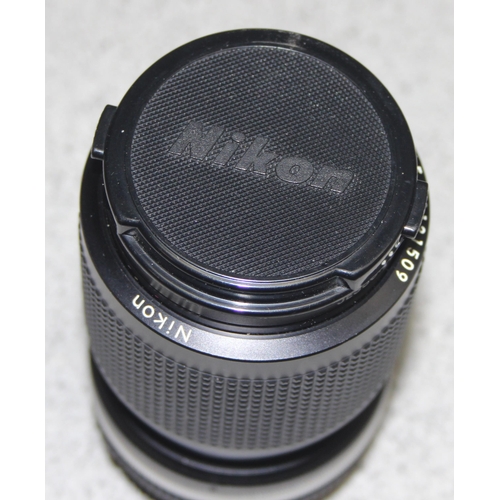 677 - Nikkor 50mm 1:1.4 lens and a Zoom Nikkor 35-105mm 1:3.5-4.5 lens, both with later cases