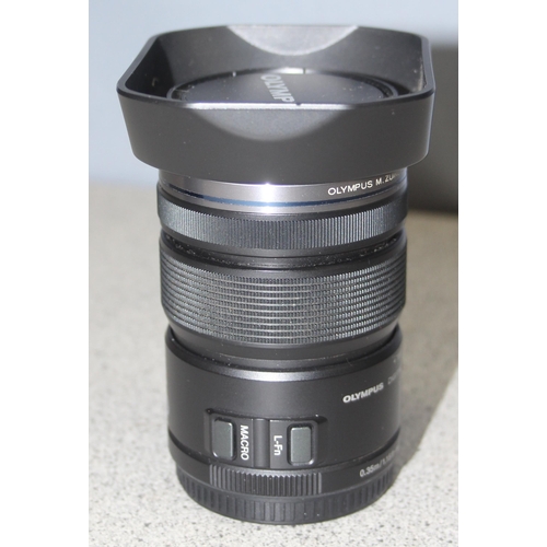 679 - Olympus M.Zuiko Digital 12-50mm 1 f/3.5-6.3 Lens with lens hood in Matin case