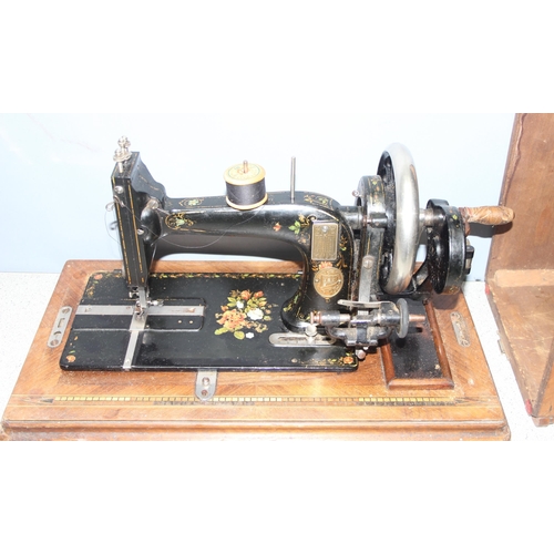 812 - German made hand-crank sewing machine, Serial No: 667231 by Max Carl Gritzner in wooden case