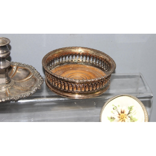 1087 - Assorted antique and later silver-plated items, mostly wine coasters chambersticks