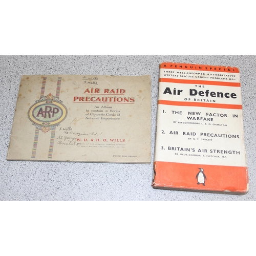 1462 - Assorted military themed books and an Air Raid Precautions cigarette card album with contents