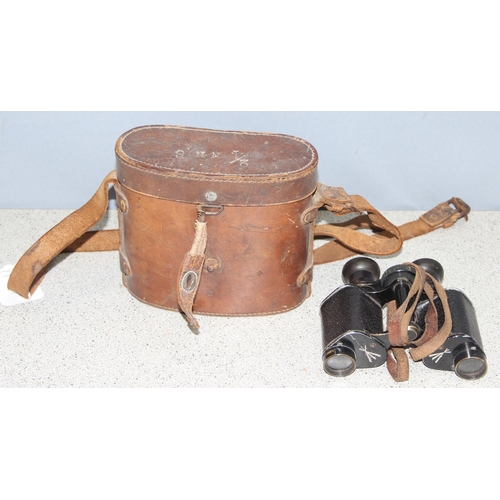 1464 - Pair of early 20th century French made private purchase x7 binoculars in leather case