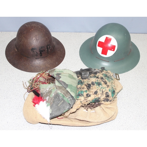 1466 - 2 x WW2 period British military Zuckerman helmets and a qty of camouflage and webbing etc