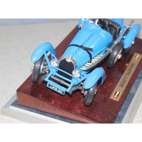 1535 - Burago model of a 1934 Bugatti 'Type 59' in blue, with display case, width of case approx 30cm