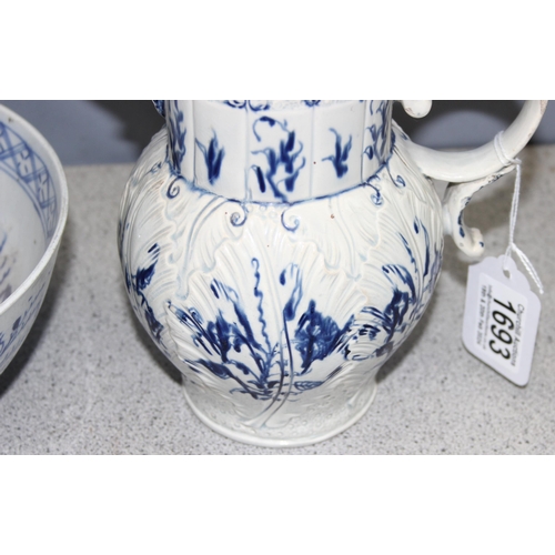 1693 - An antique blue and white pearlware jug with moulded leaf design and bacchanalian spout, approx 18cm... 