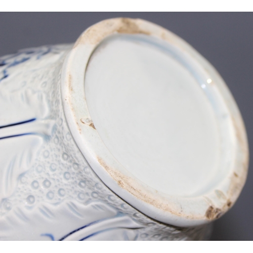 1693 - An antique blue and white pearlware jug with moulded leaf design and bacchanalian spout, approx 18cm... 