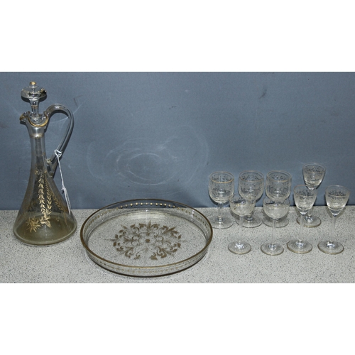 1699B - Vintage handblown decanter with liqueur glasses and glass tray, with gilt etched design, in the mann... 